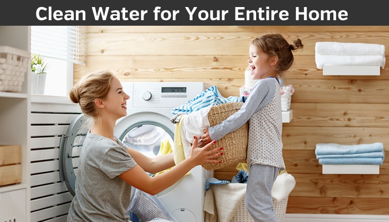 mom and daughter doing laundry together