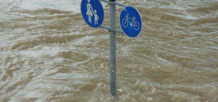 Street sign showing above flood waters