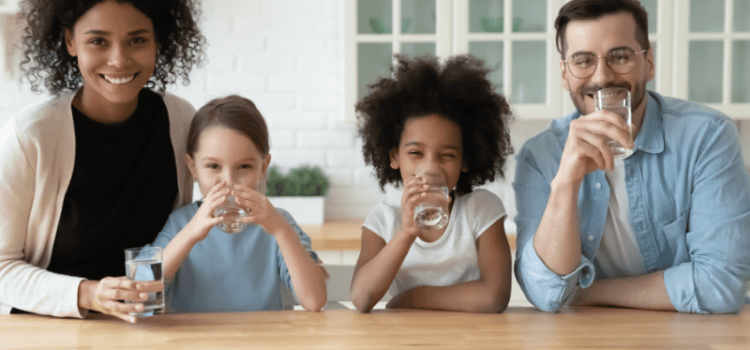 Family drinking pure water in Houston