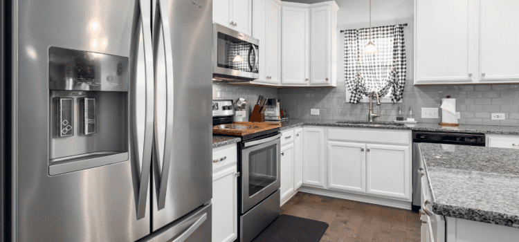 An image of a kitchen that potentially needs water filtration to its refrigerator and to the home tap.