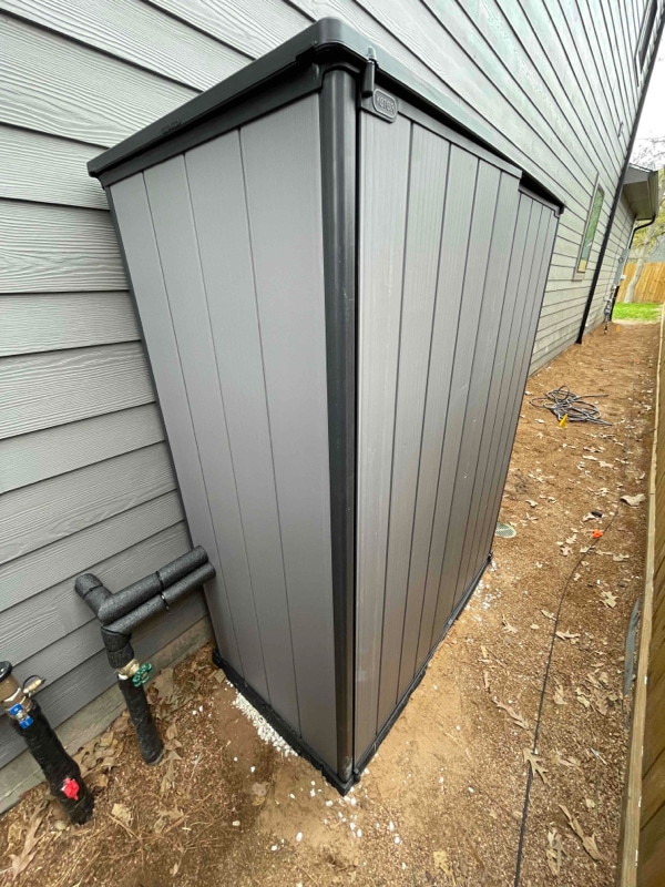 A shed that houses a recently installed home water softener.