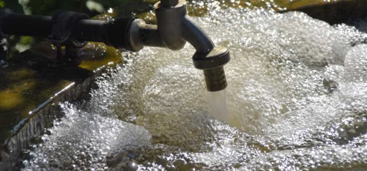 Clean and purified Houston TX water flowing from a faucet, providing refreshing hydration with effective filtration.