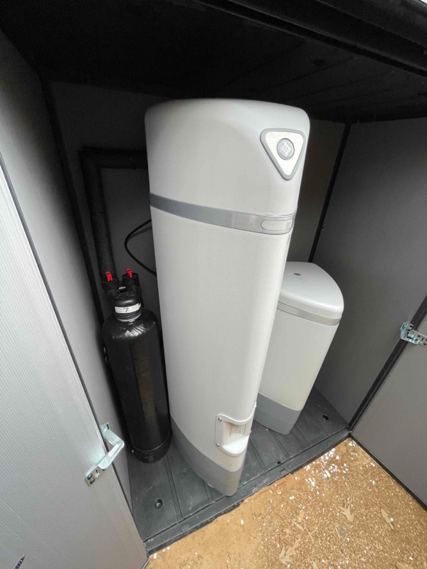 A water softener installed in a shed for a home in Houston.