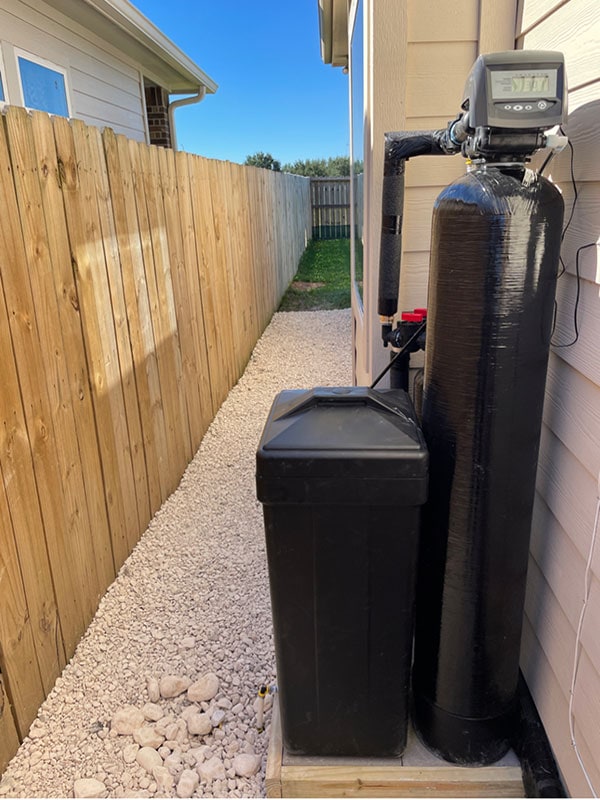 An outside installation of a Houston Water Solutions treatment system.