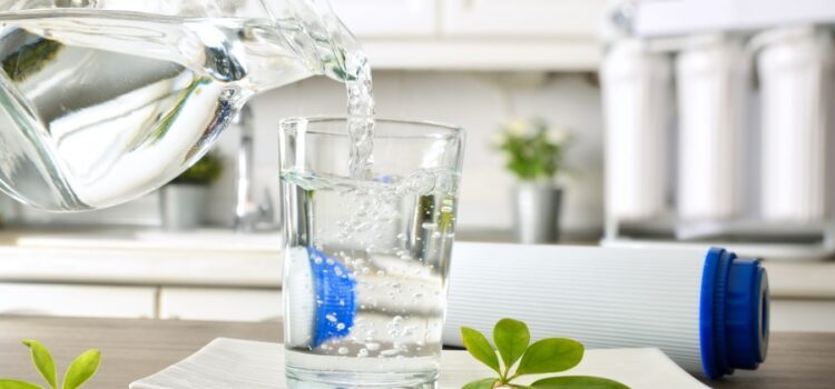 An image of a hand serving clear water thanks to their Houston water filters